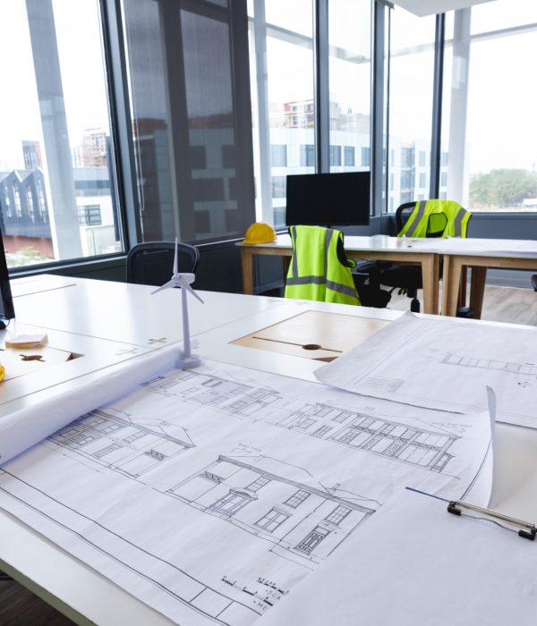 Interior of empty modern office with desks computers and drawings. modern office of a creative design business.